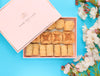 Luxury branded, pink box with delicious regular baklava pieces, decorated with white flowers