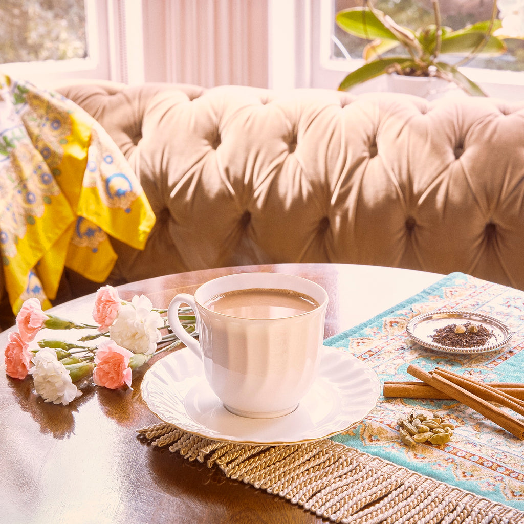 A cup of Classic Massala Chai in a relaxed and bright living room