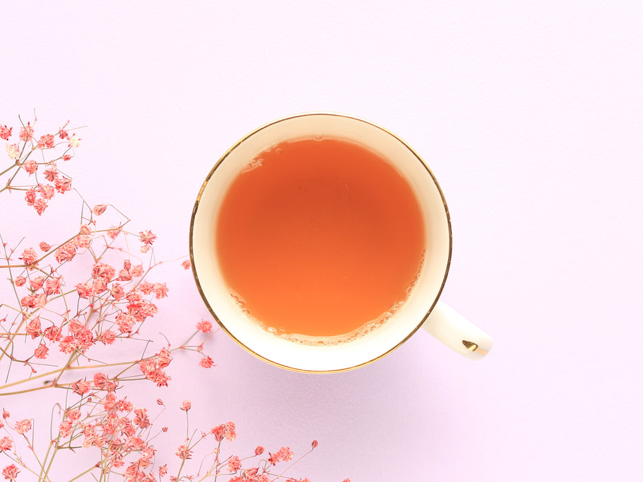 Vibrant peach colour of the tea made with China Pink Tropics