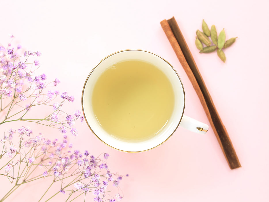 The light green colour of the brewed Pure Green Chai in a cup